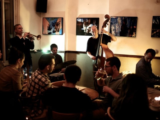 The "Olden You Quartet" plays at the Beit Haamudim bar and Jazz club during a concert in Tel Aviv on April 5, 2016. Several Israeli musicians are now helping to nurture a burgeoning local scene after years abroad where they trained and played with the be